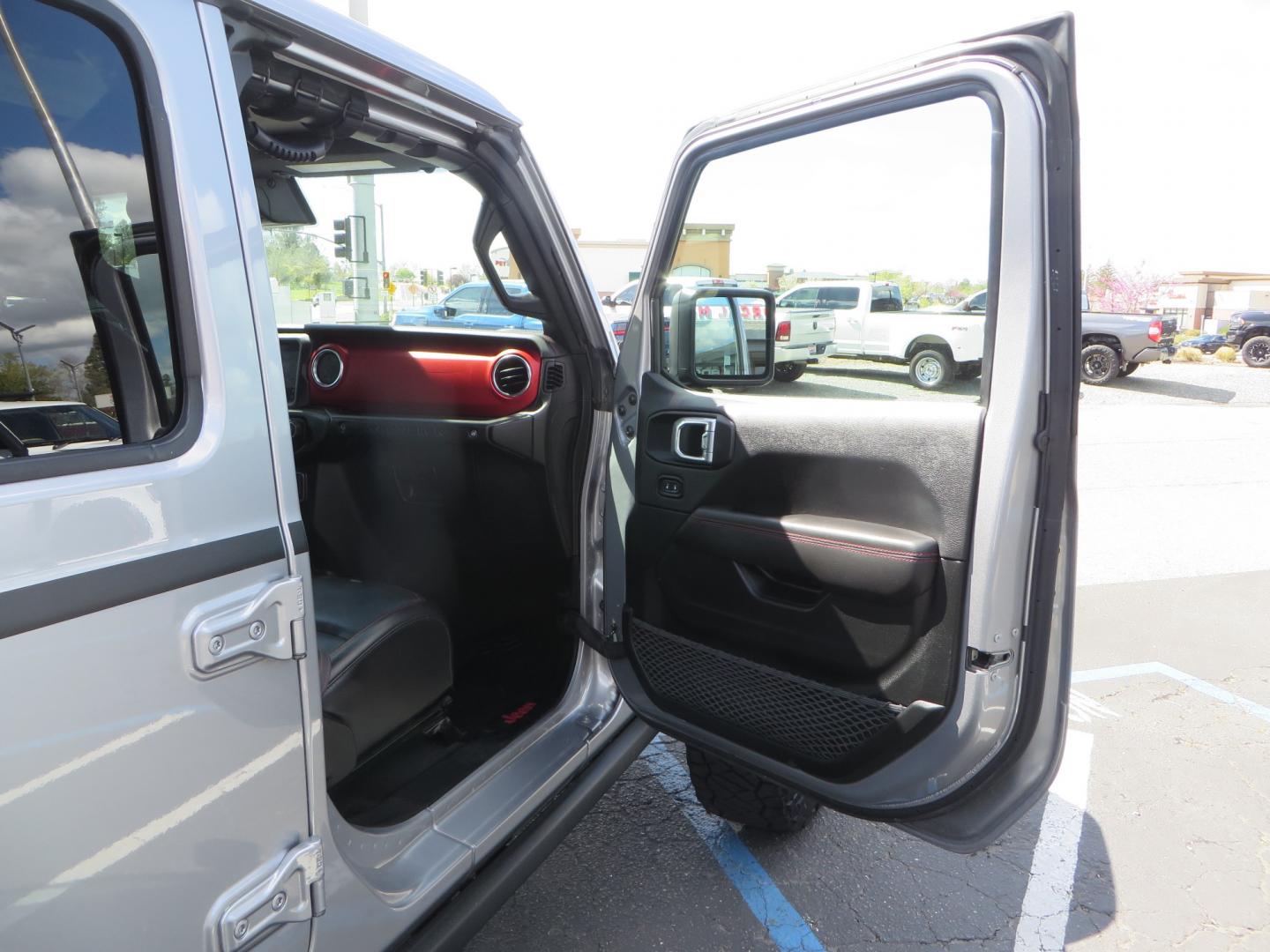 2021 SILVER /BLACK Jeep Wrangler Unlimited Rubicon (1C4HJXFG7MW) with an 3.6L V6 DOHC 24V FFV engine, 6A transmission, located at 2630 Grass Valley Highway, Auburn, CA, 95603, (530) 508-5100, 38.937893, -121.095482 - Features - Zone Offroad 3" Lift kit, Fox shocks, 37" Nitto Ridge Grappler tires, 17" Fuel Piston wheels, Warn winch, KC led lights, Voswitch switches, Teraflex HD tire relocation, Fire extinguisher, High Lift Jack, Shovel, Axe, Jumper Cables, and flat towable. - Photo#46